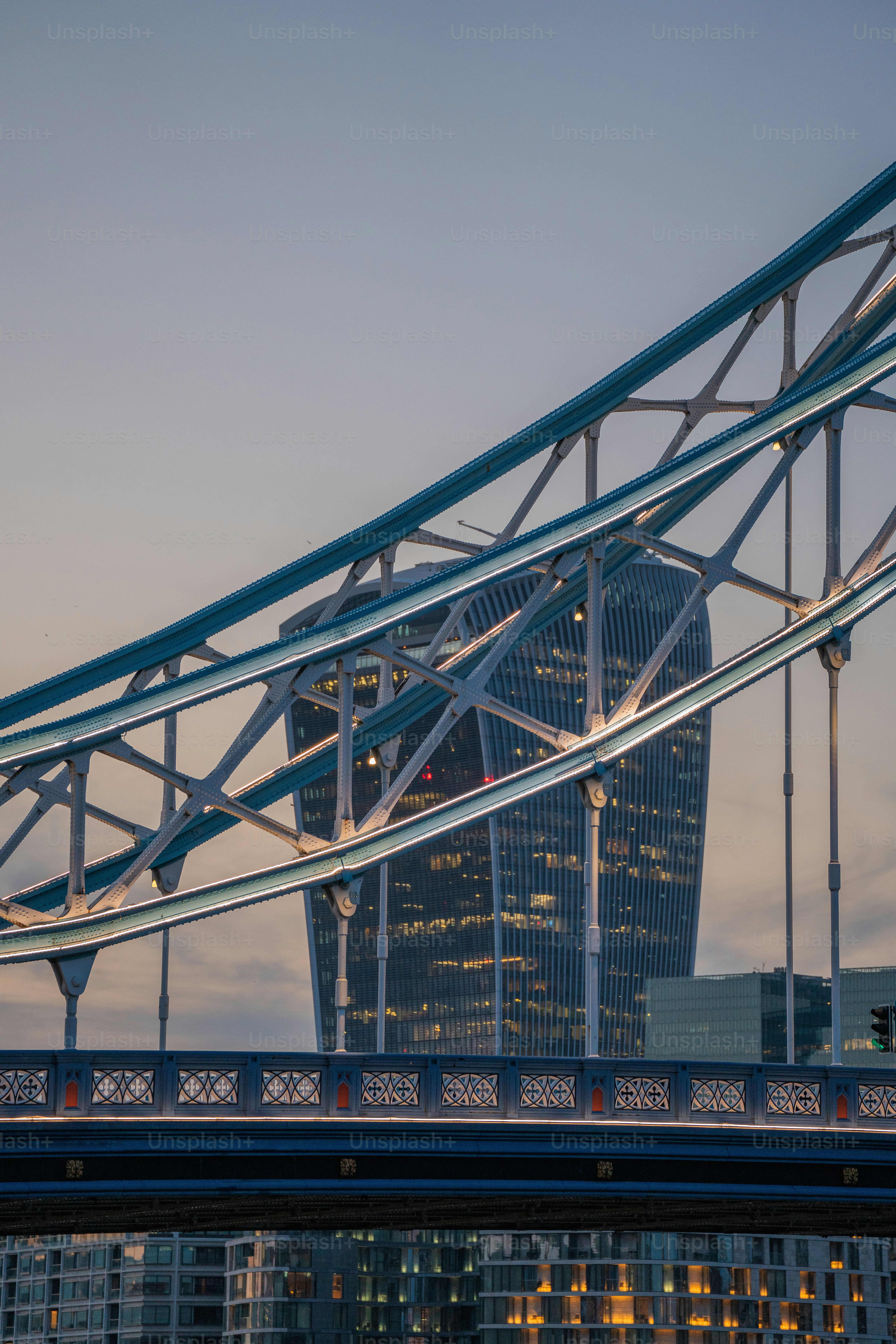 a bridge with a very tall building in the background