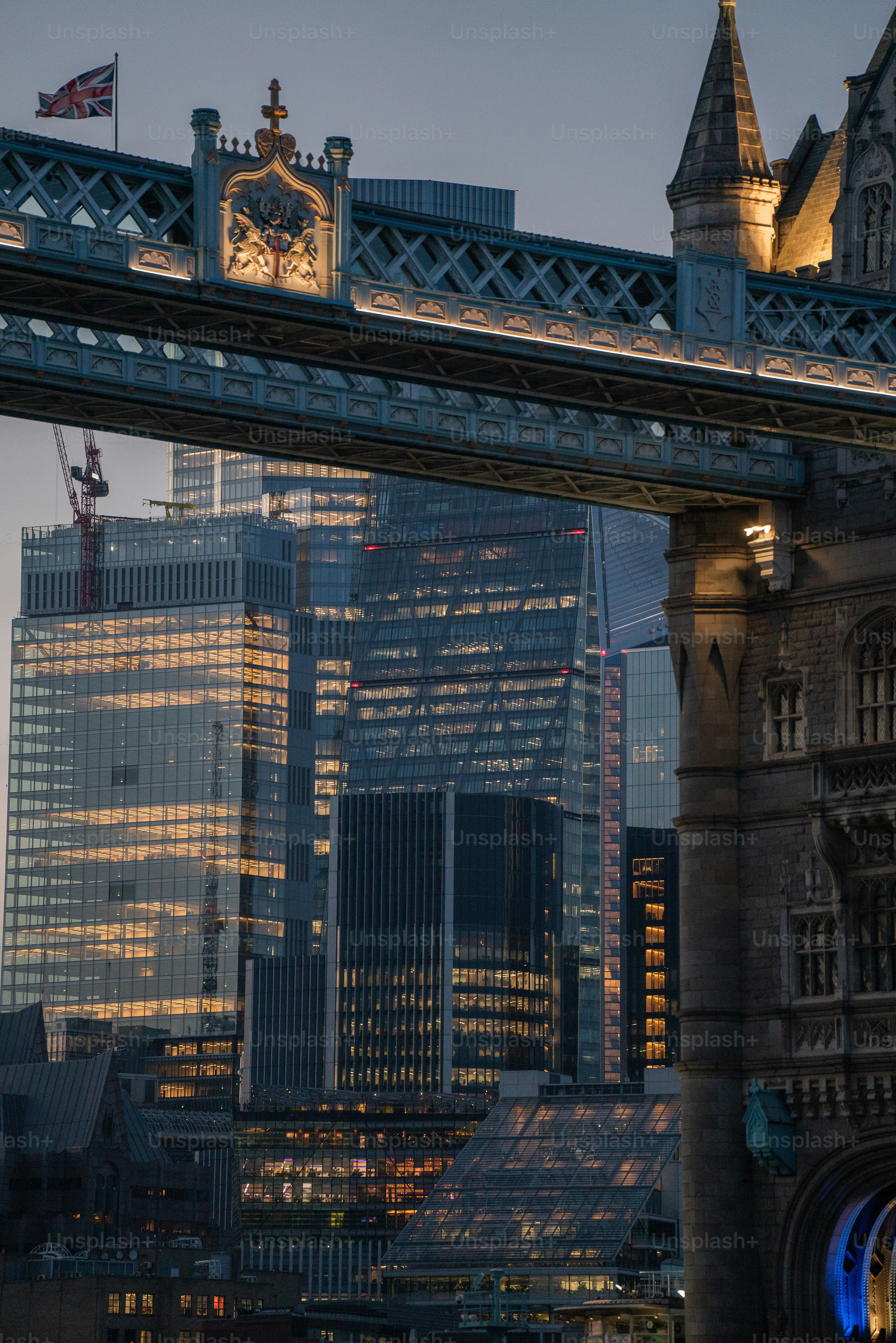 a view of a bridge with a clock tower in the background