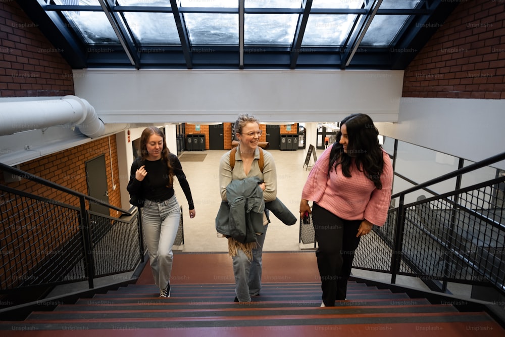 a group of women walking down a flight of stairs
