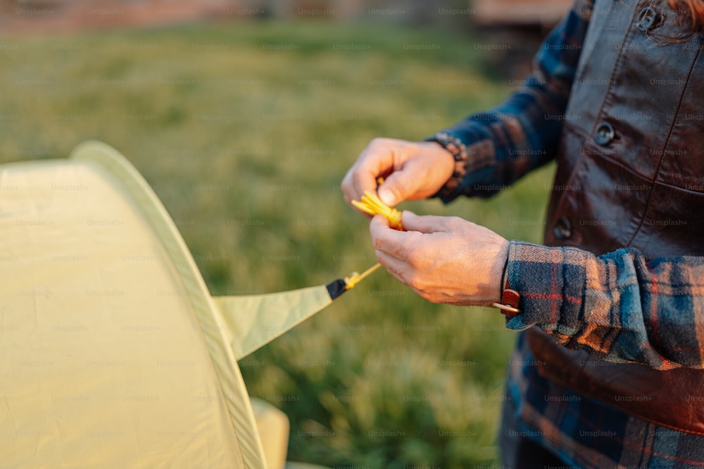 a person holding a yellow object in their hands