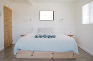 a bed with a blue blanket on top of it