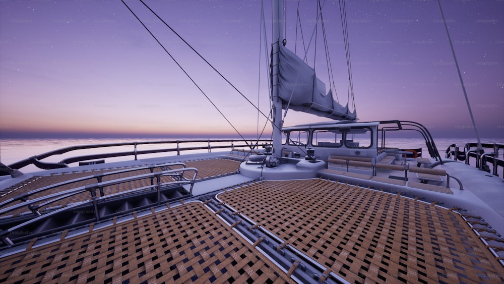 a view of the deck of a sailboat at dusk