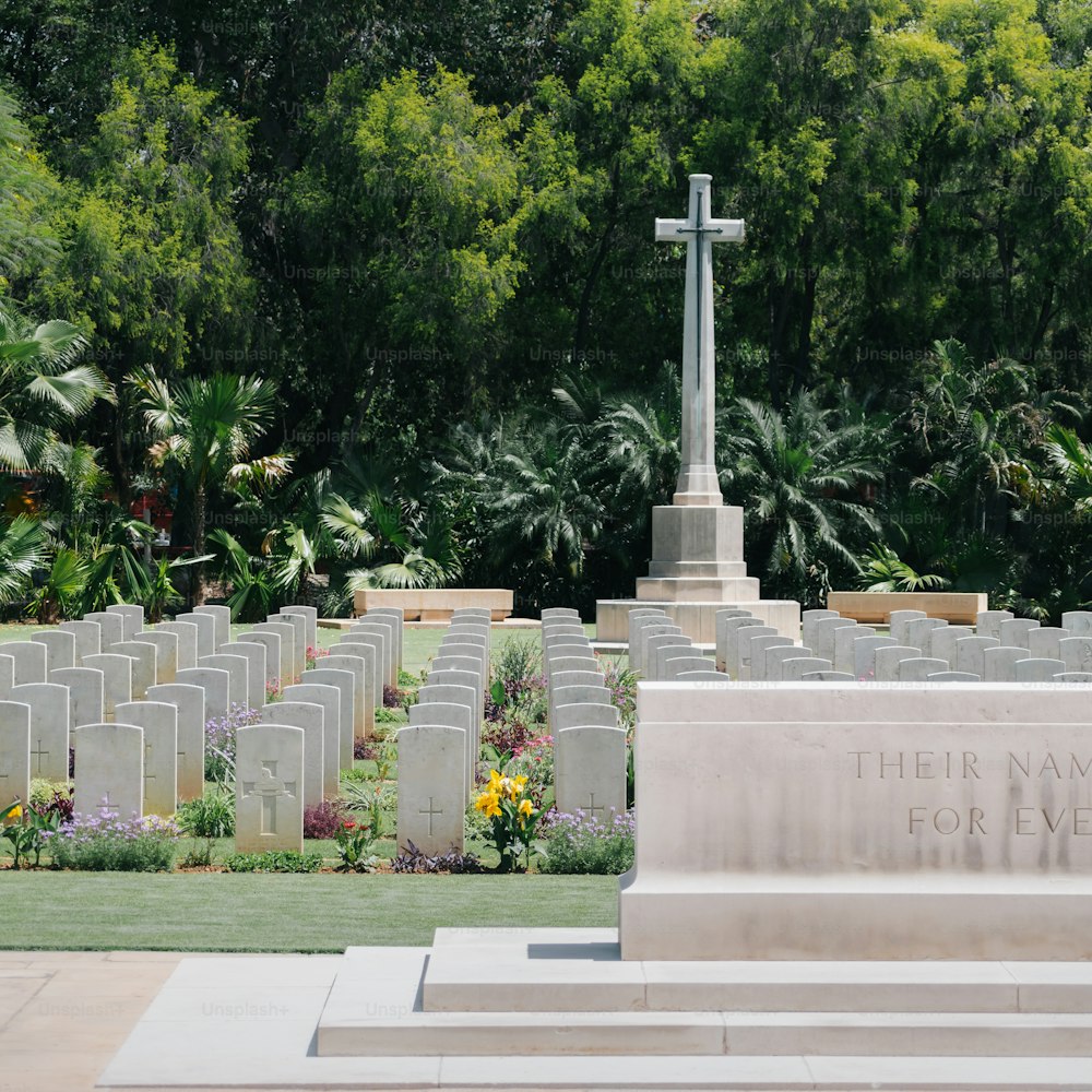 a cemetery with a cross in the middle of it