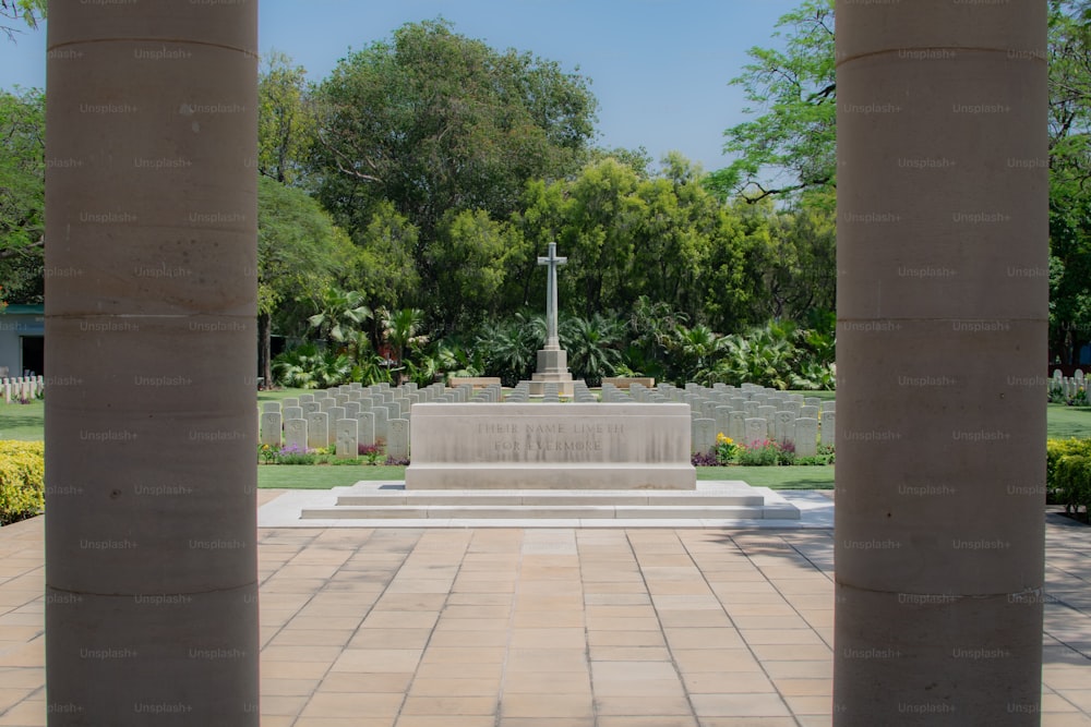 a view of a memorial with a cross in the middle of it