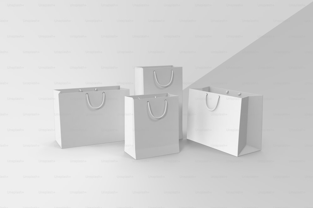 a group of three white bags sitting next to each other