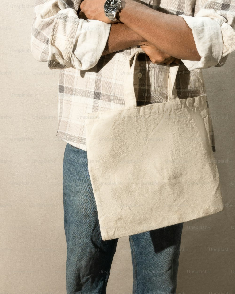 a man holding a white bag in his hands