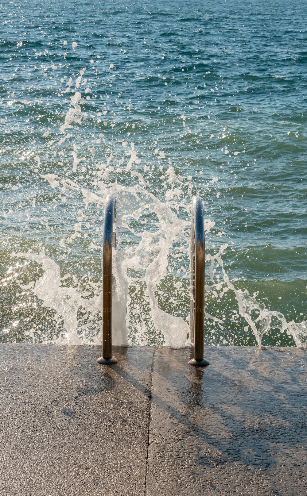 a couple of poles that are by some water