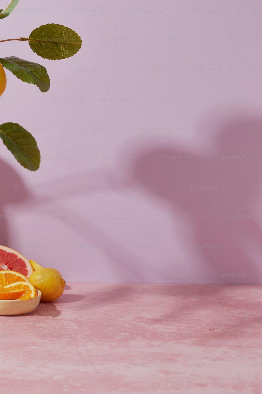 a grapefruit cut in half next to a grapefruit