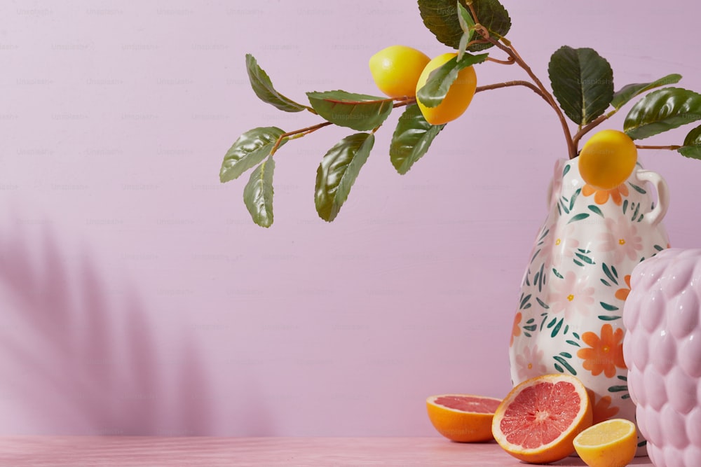 a grapefruit and a grapefruit in a vase on a table