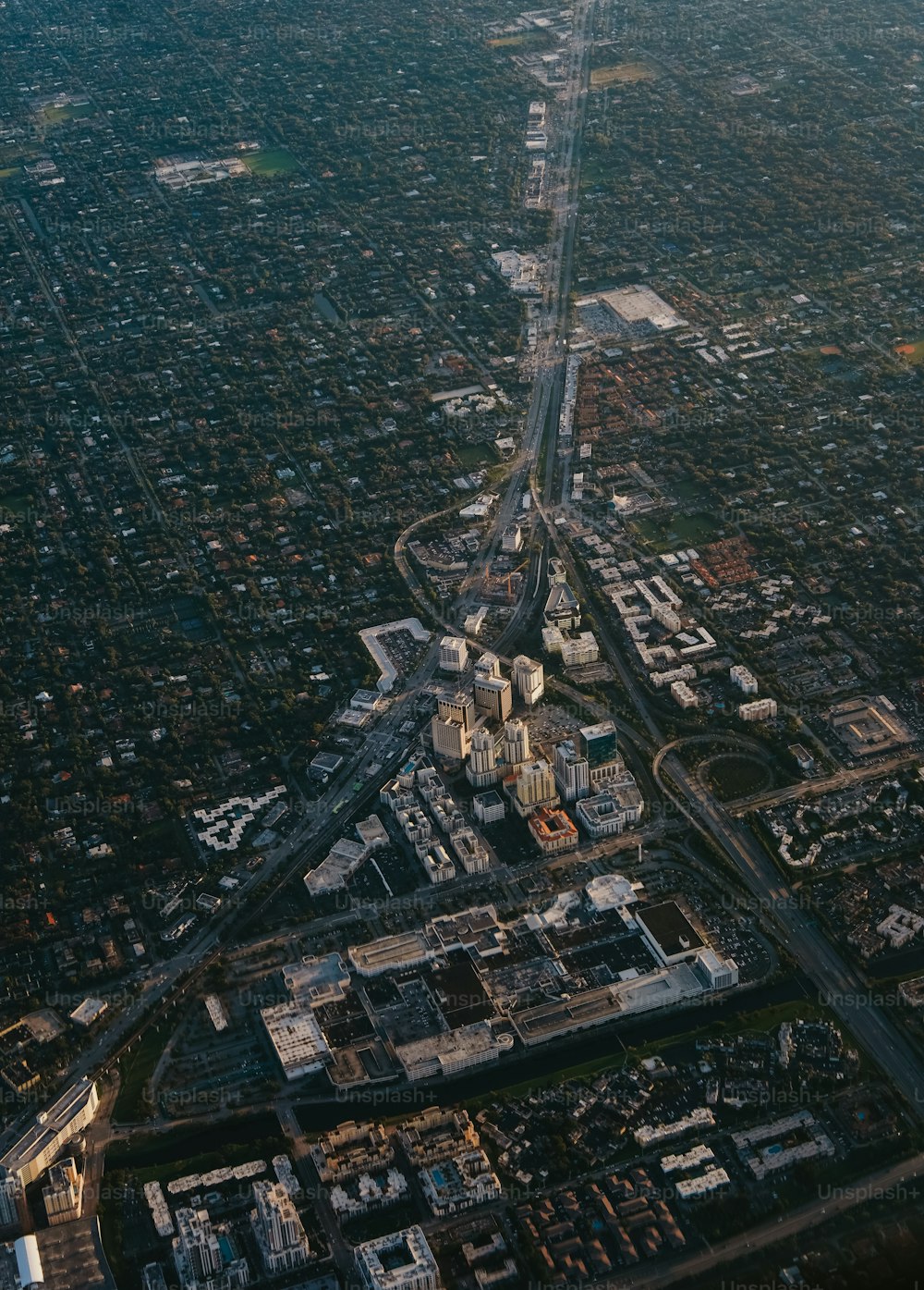 an aerial view of a city with buildings and roads