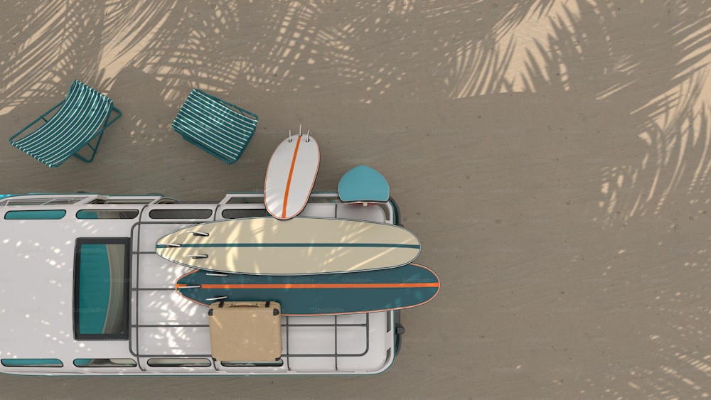 an aerial view of a beach with surfboards and chairs