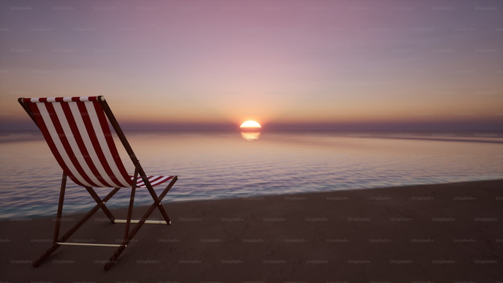 Una silla roja y blanca sentada en la parte superior de una playa