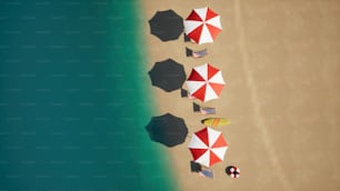 Eine Gruppe von Sonnenschirmen, die auf einem Sandstrand sitzen