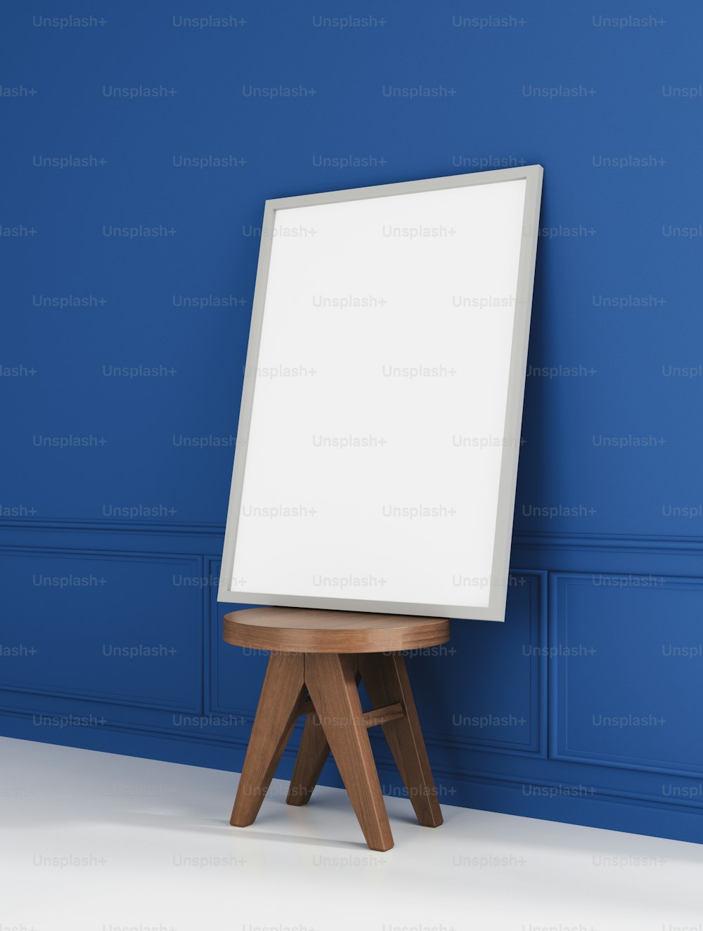 an easel stands in front of a blue wall