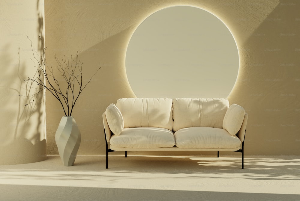 a white couch sitting in front of a round window