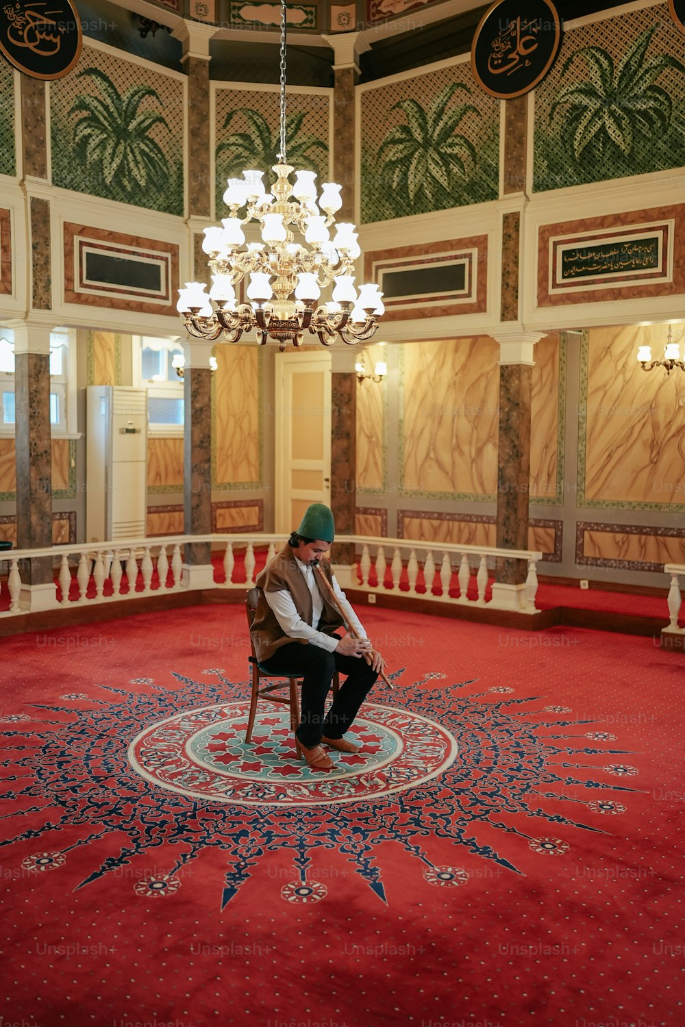 a man sitting on a chair in a room