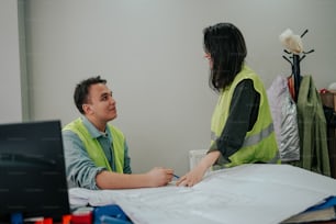 a man and a woman sitting at a table