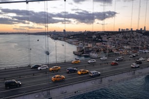 a bunch of cars that are on a bridge