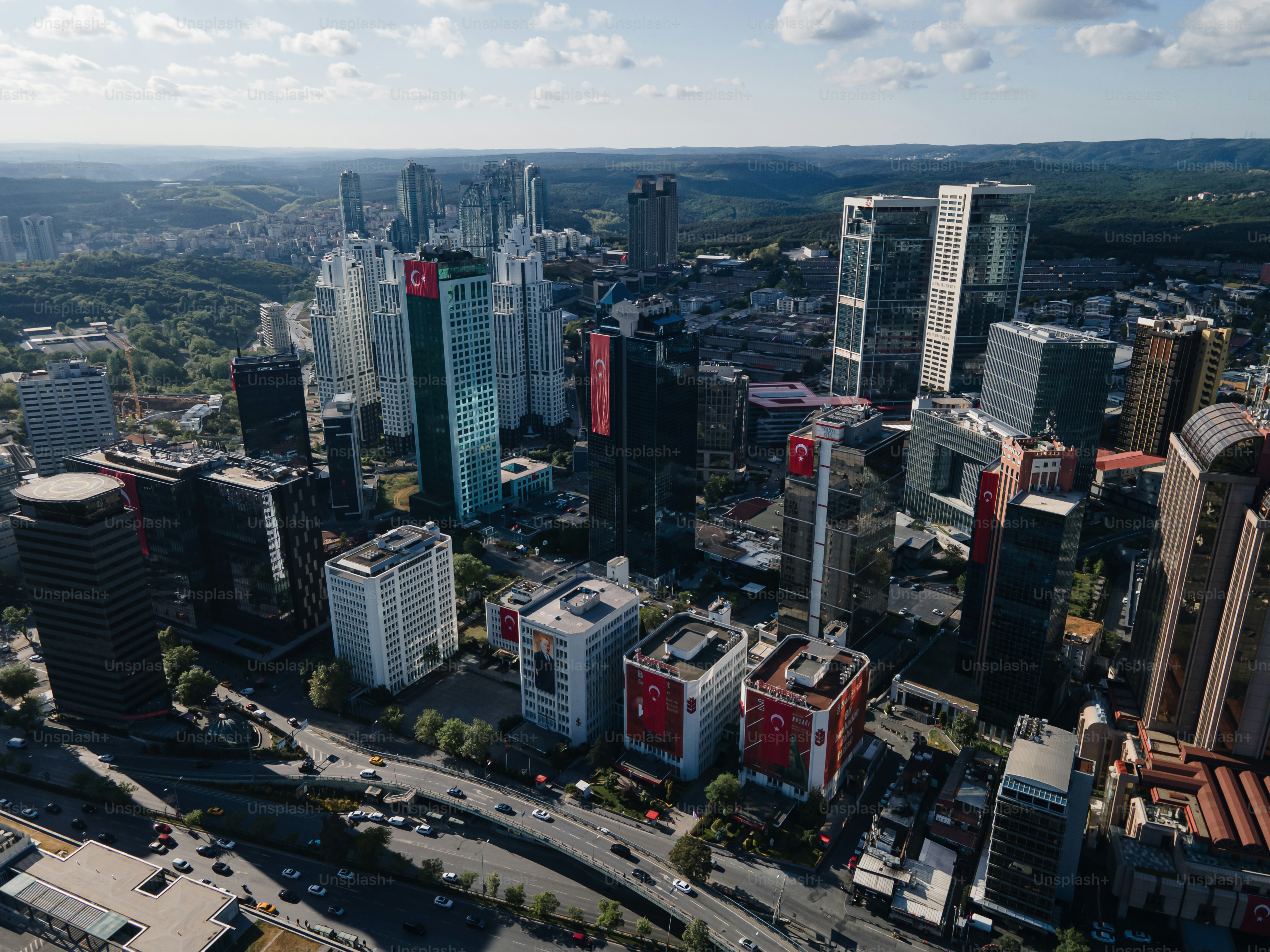 an aerial view of a city with tall buildings