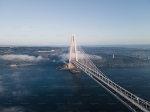 an aerial view of a bridge over a body of water