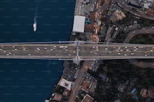 an aerial view of a bridge over a body of water