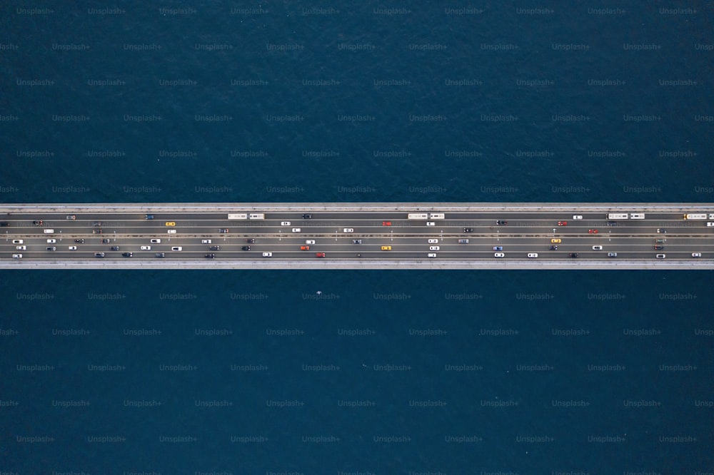 an aerial view of a highway in the middle of the ocean