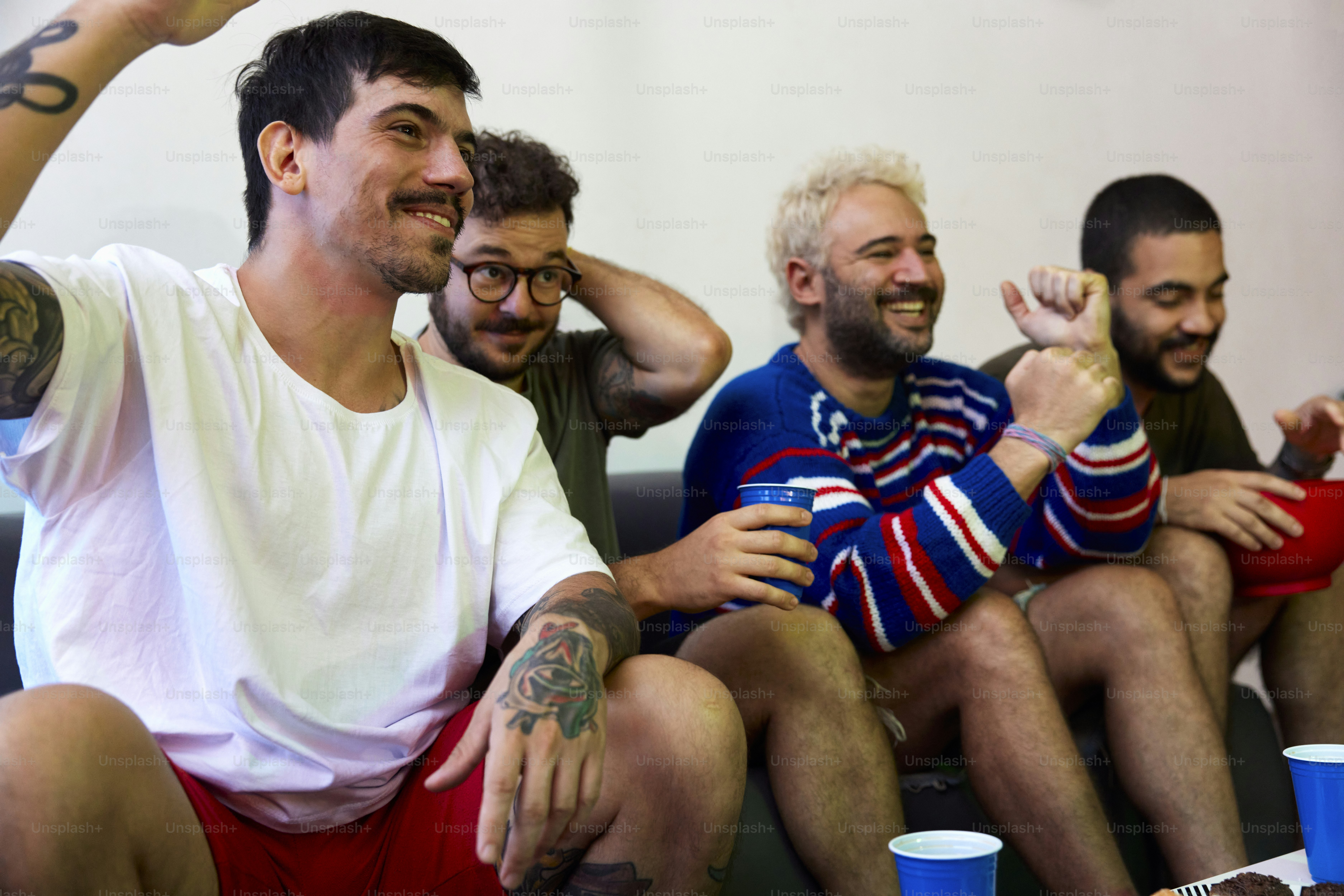 a group of men sitting next to each other