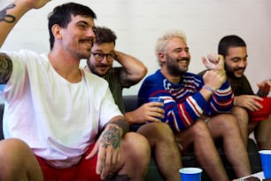 a group of men sitting next to each other