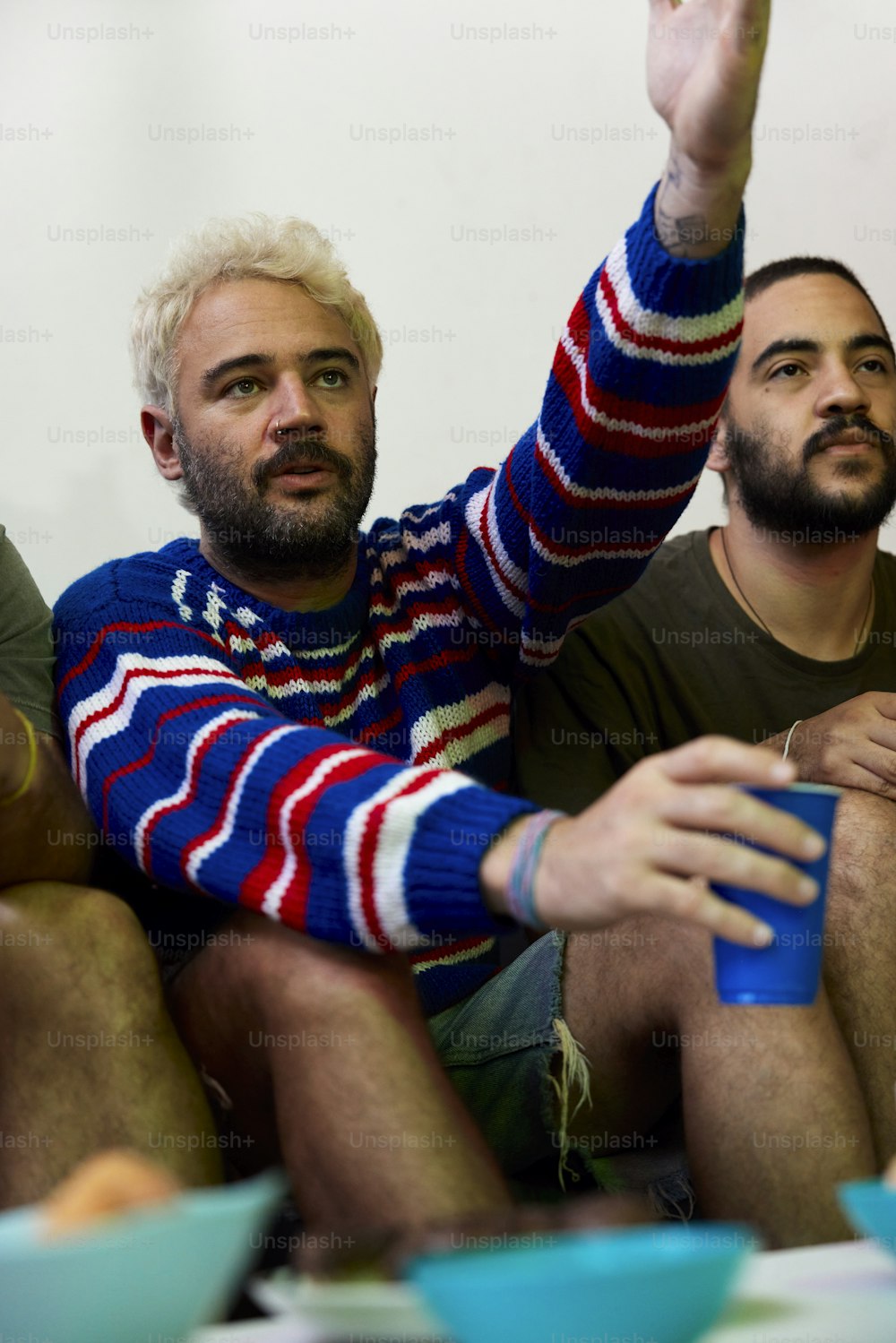 a group of men sitting next to each other