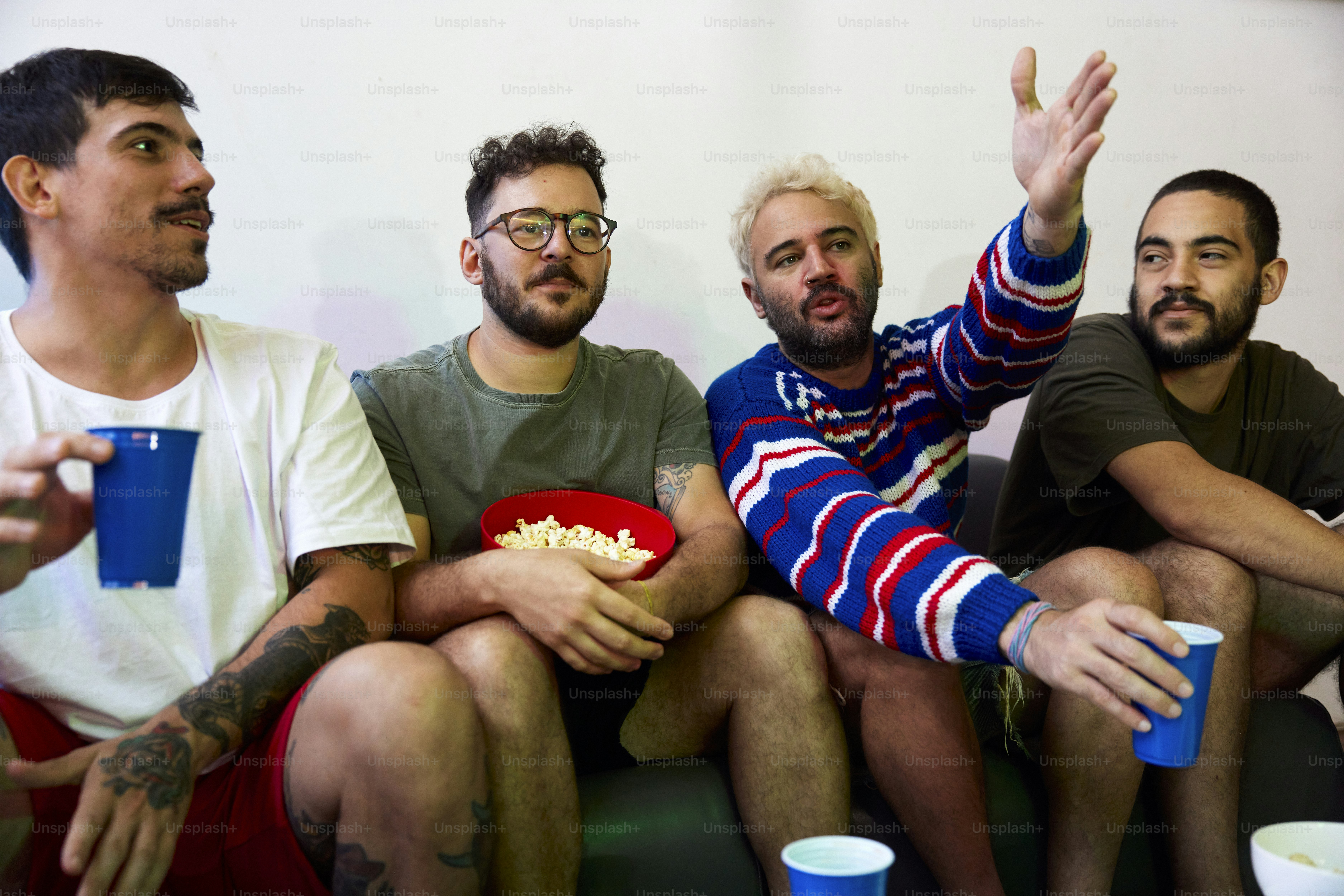 a group of men sitting next to each other