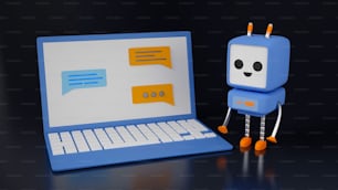 a small robot next to a laptop computer