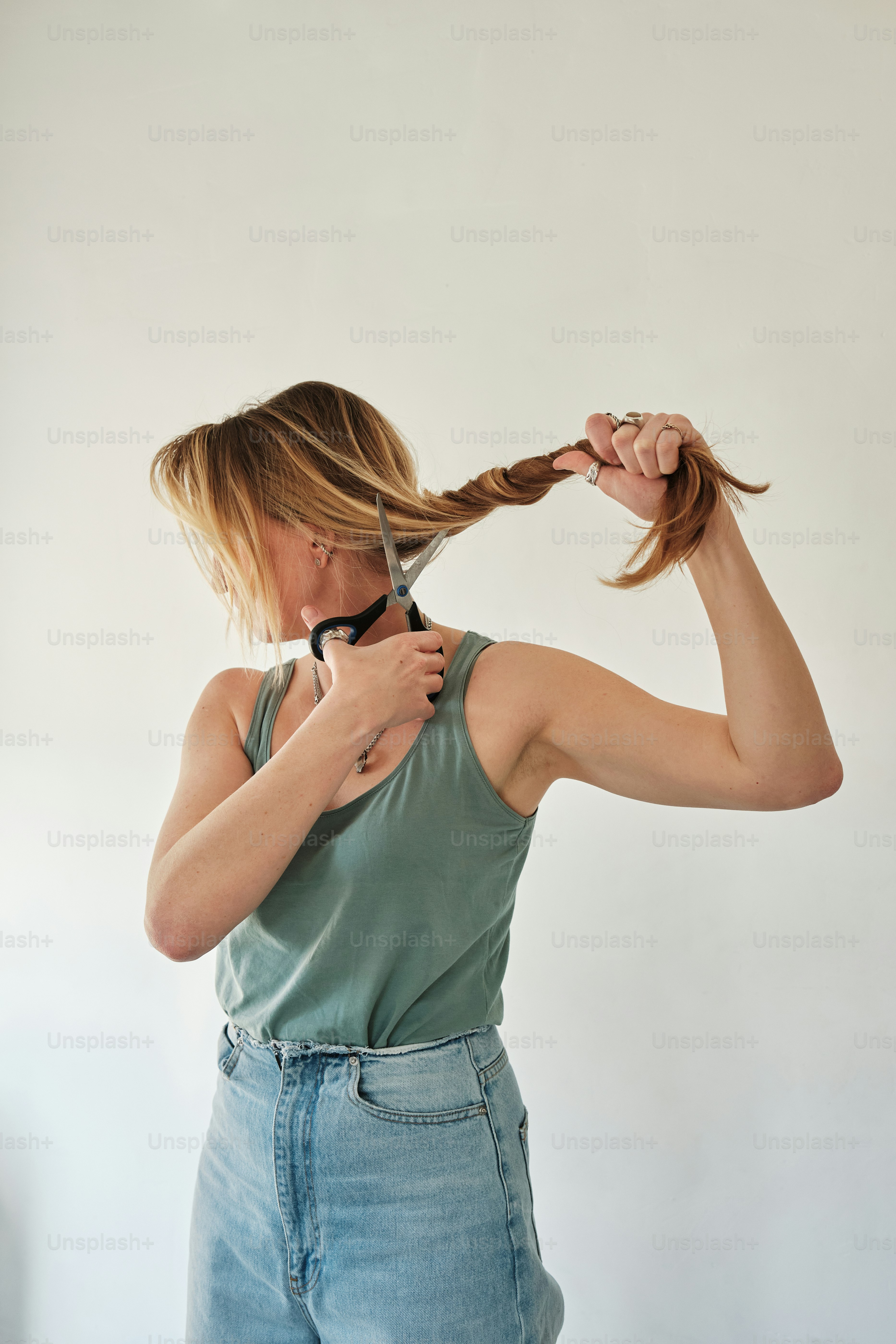 Woman cutting her hair