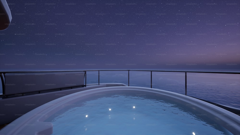 a hot tub on a cruise ship at night