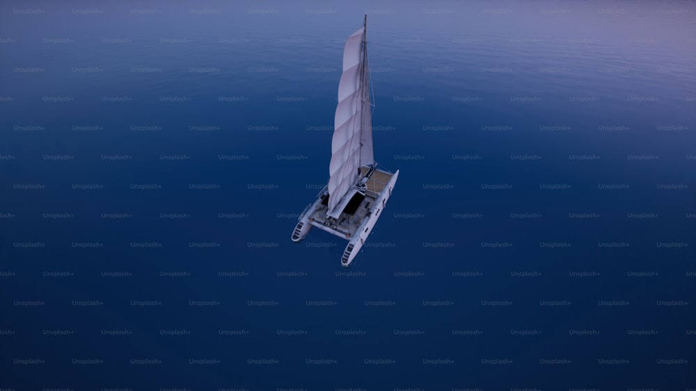una barca a vela che galleggia sulla cima di uno specchio d'acqua