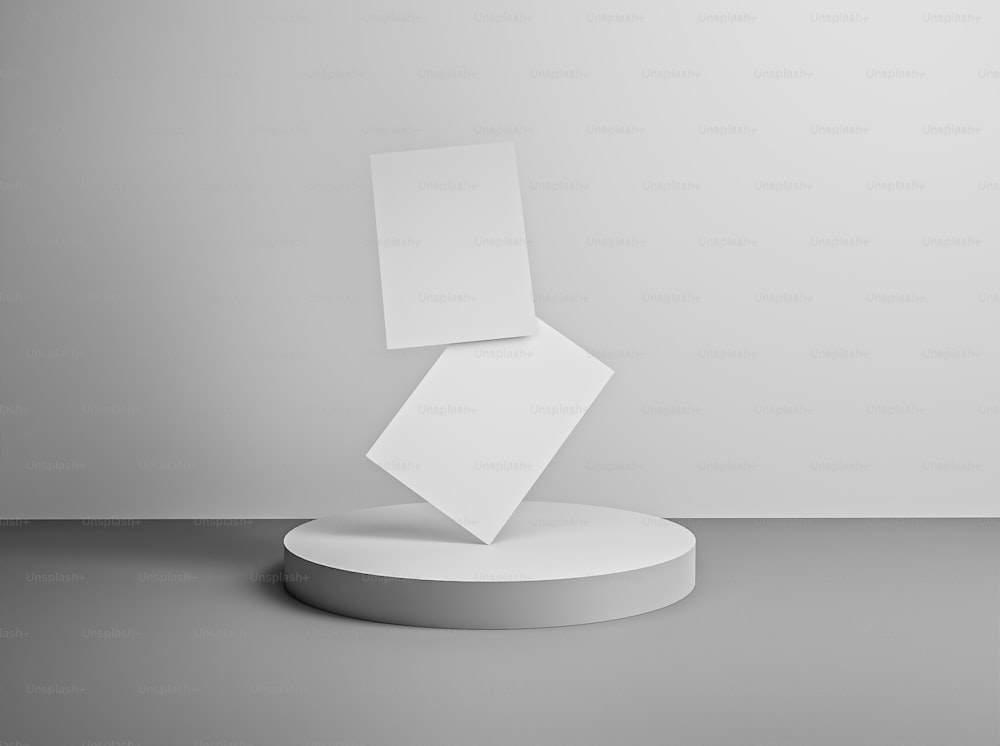 a white pedestal with a piece of paper on top of it