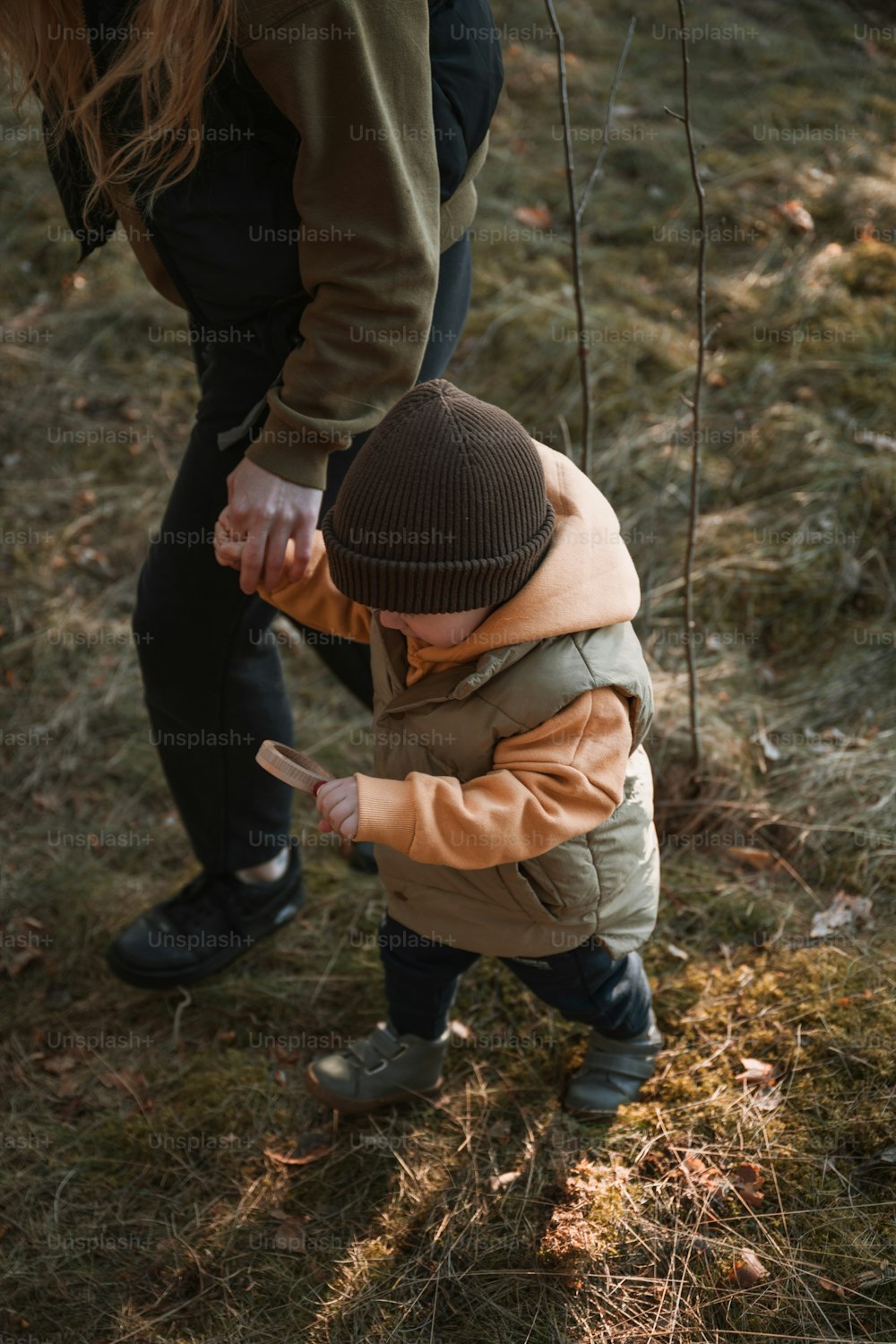 a small child reaching for something with his hand