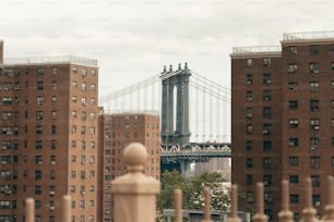 a view of a bridge over a city with tall buildings