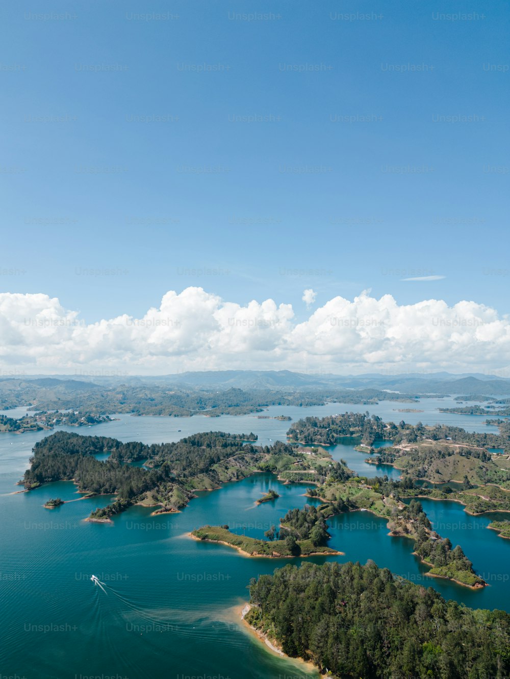 an aerial view of a body of water surrounded by land