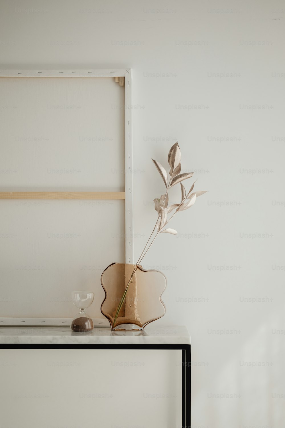 a plant sitting on top of a table next to a window