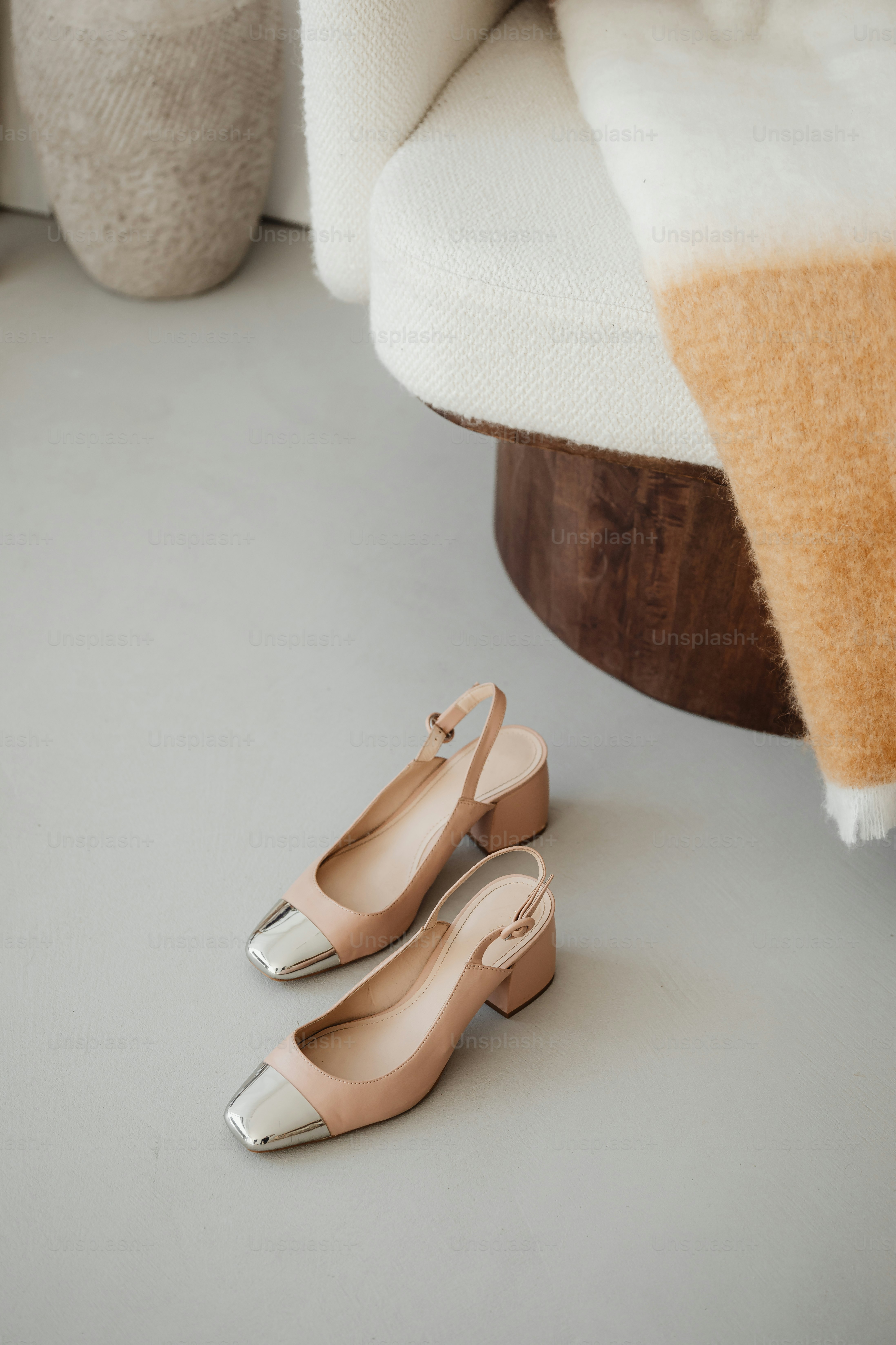 a pair of shoes sitting on top of a white floor