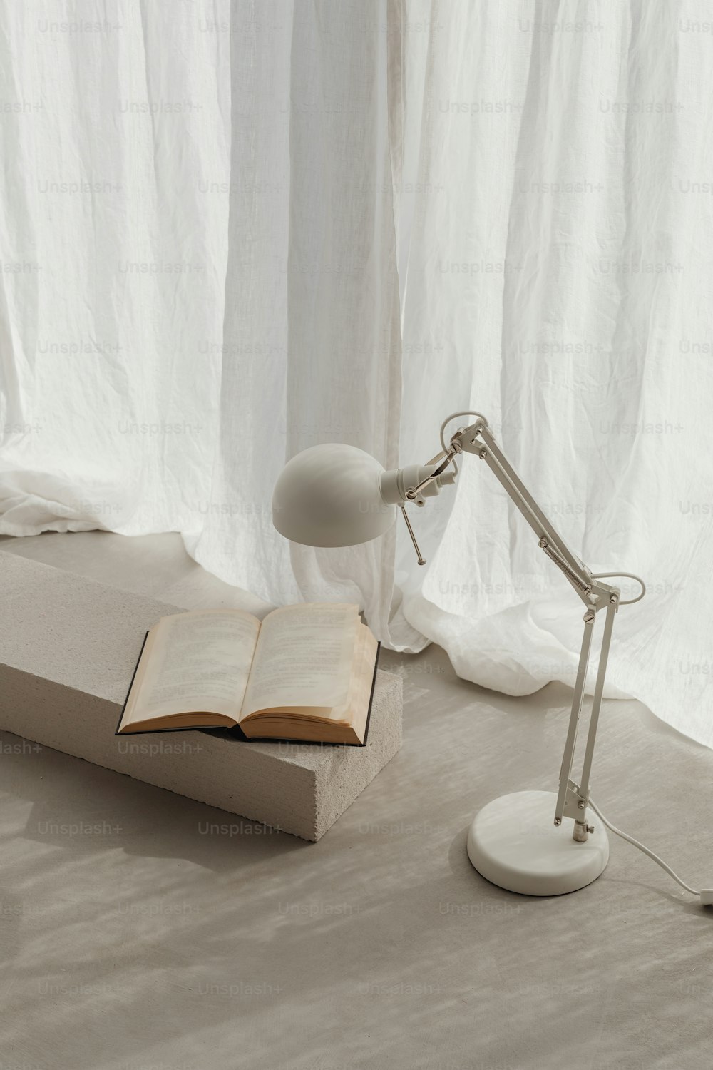 a lamp and a book on a table