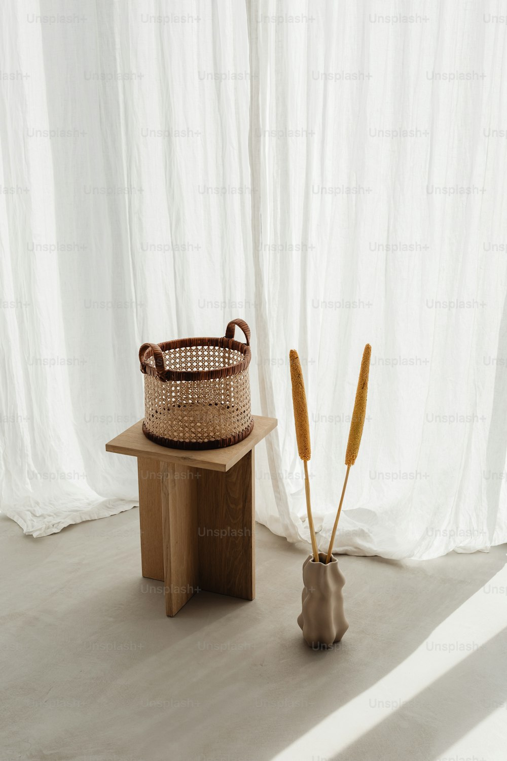 a basket sitting on top of a wooden table next to a basket
