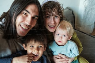 a man and two women and a child posing for a picture