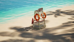 a life preserver sitting on a beach next to a body of water