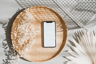 a cell phone sitting on top of a wooden plate