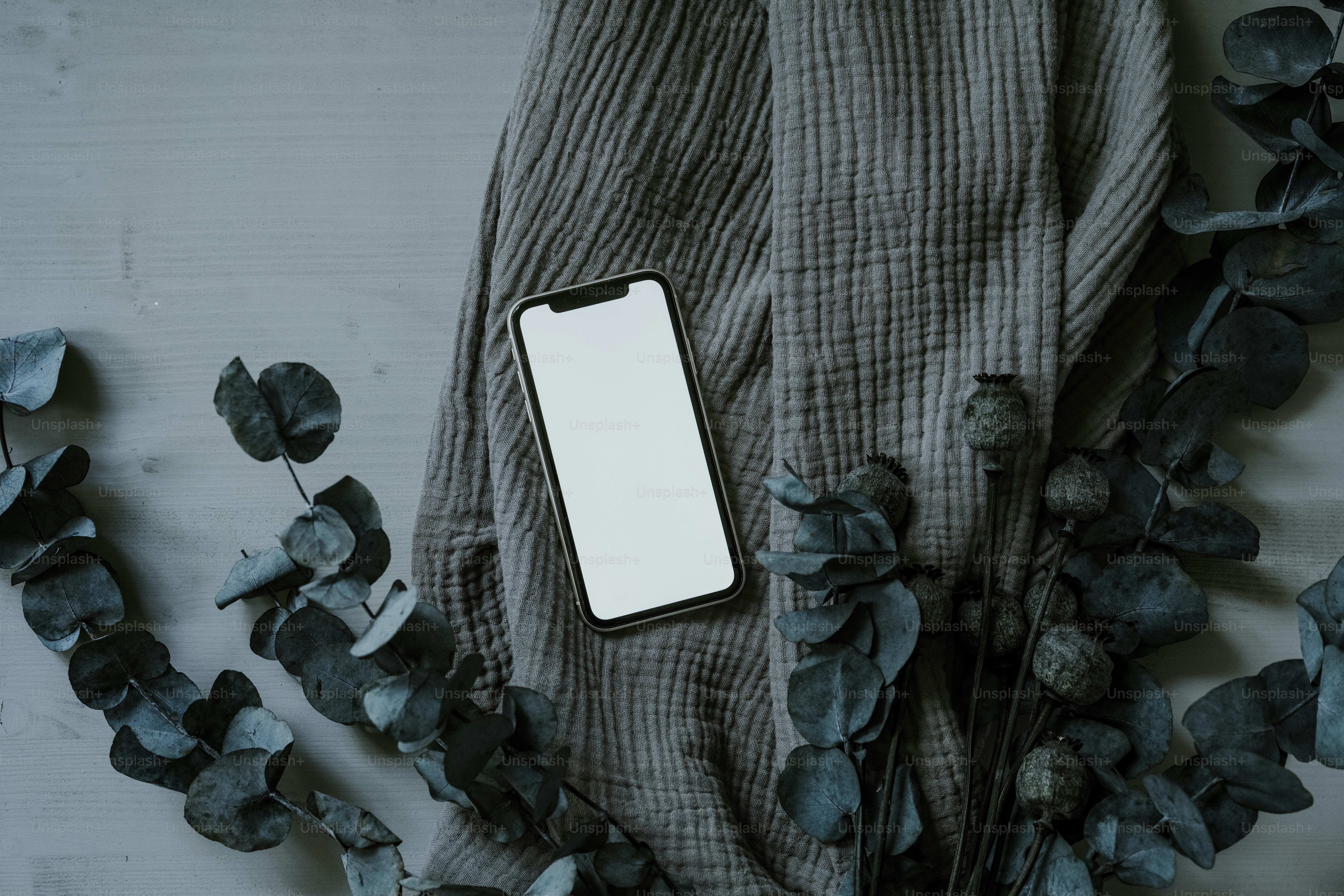 a cell phone sitting on top of a wooden table