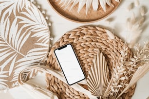 a cell phone sitting on top of a wicker basket