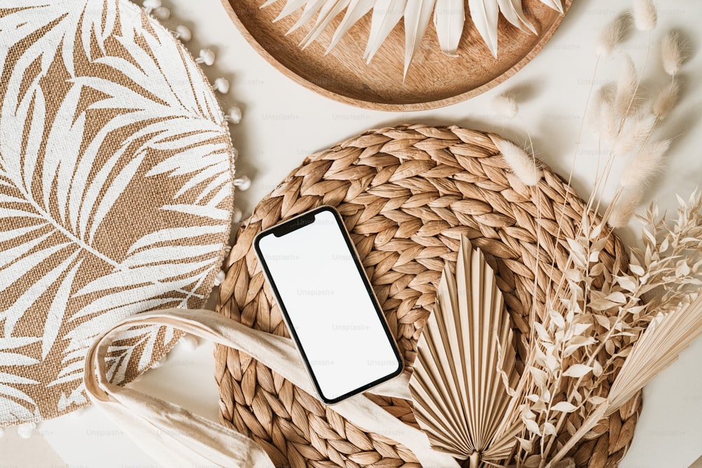 a cell phone sitting on top of a wicker basket