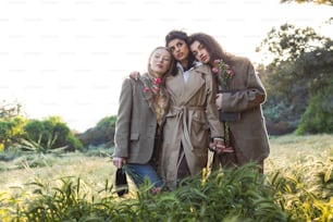 a group of three women standing next to each other