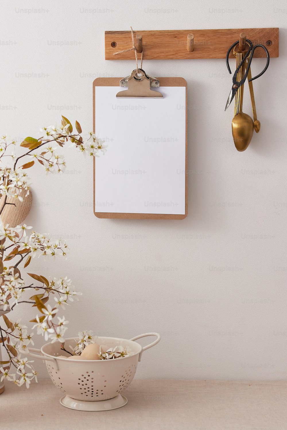 a wooden clipboard with a clipboard attached to it next to a bowl of